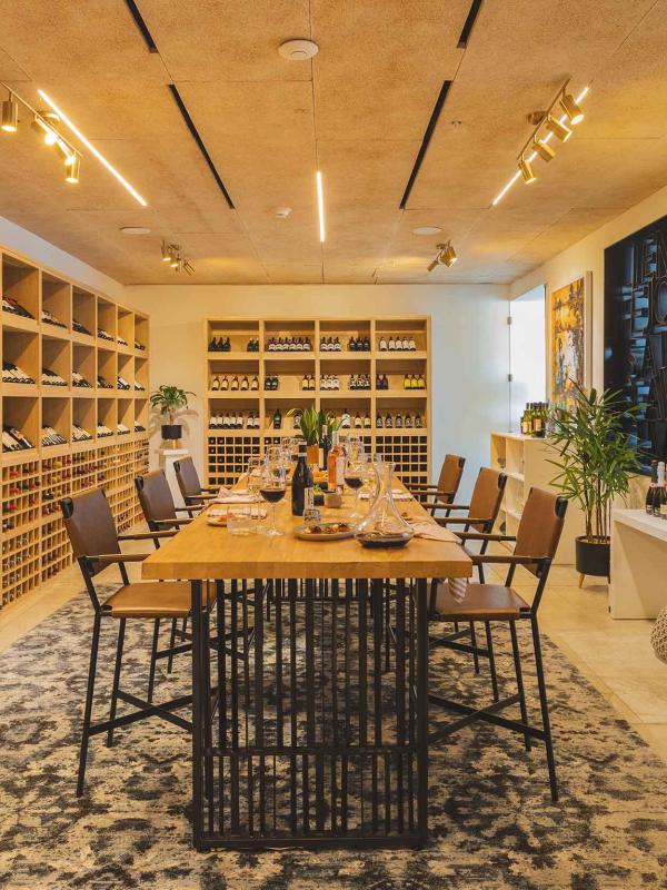 Viceroy Los Cabos' Wine Room, a bright cellar with floor-to-ceiling wine racks