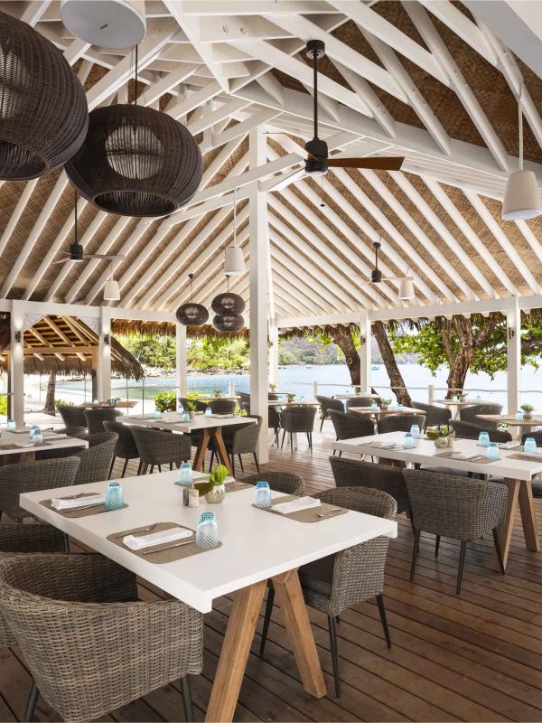 The outdoor restaurant Jalousie Grill, under a vaulted wooden roof
