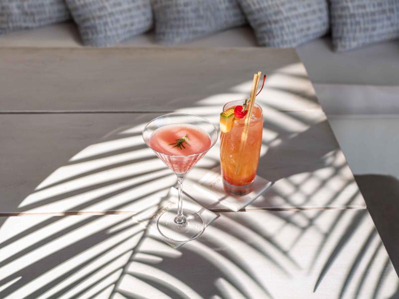 two cocktails on an outdoor table