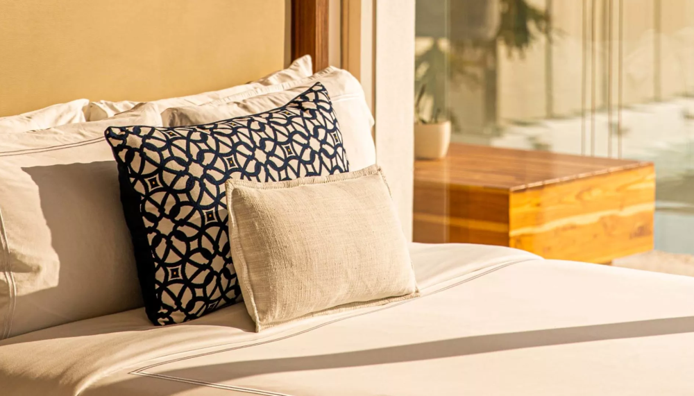 3 pillows on a bed in a suite at Viceroy Los Cabos