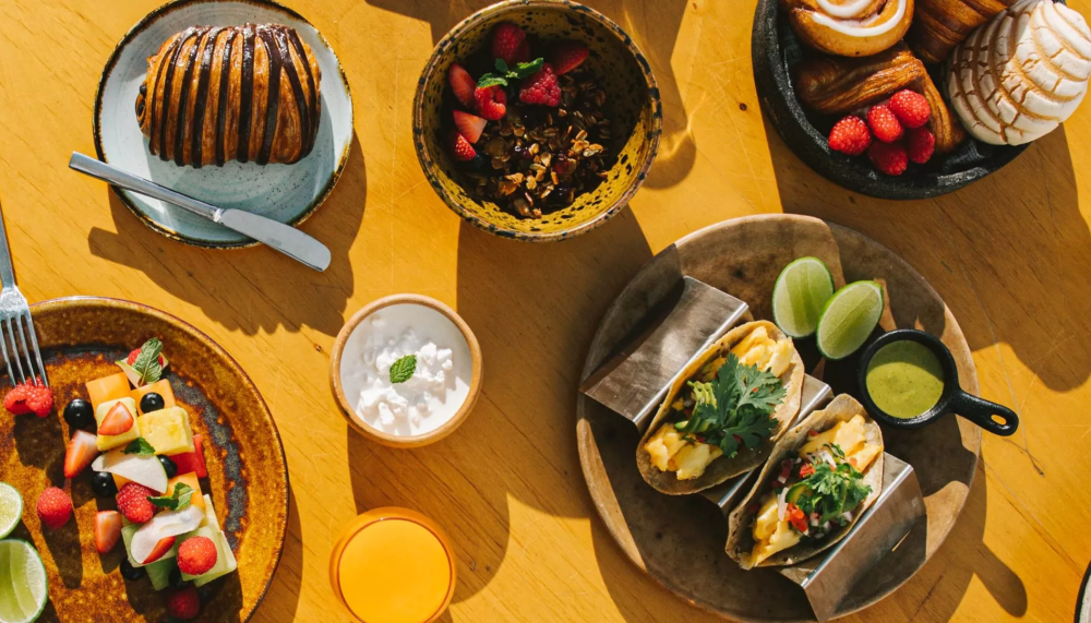 A spread of food including tacos and pastries at Viceroy Los Cabos