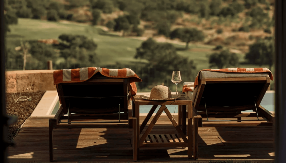 Two lounge chairs overlooking the pool at Ombria Algarve