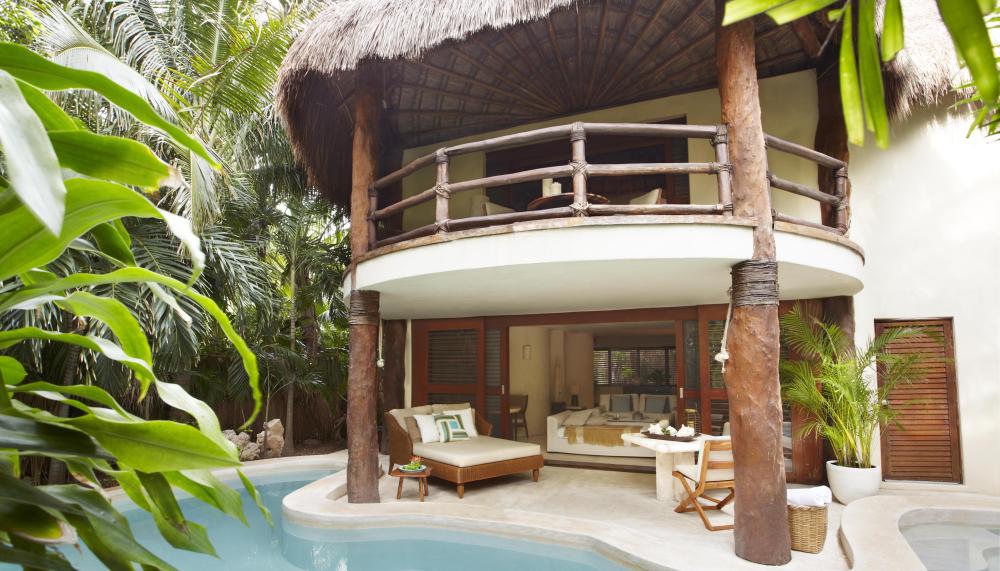 Exterior of a room at Riviera Maya with a private pool and lounge area