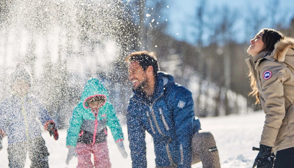 A family playing in the snow at Viceroy Serbia