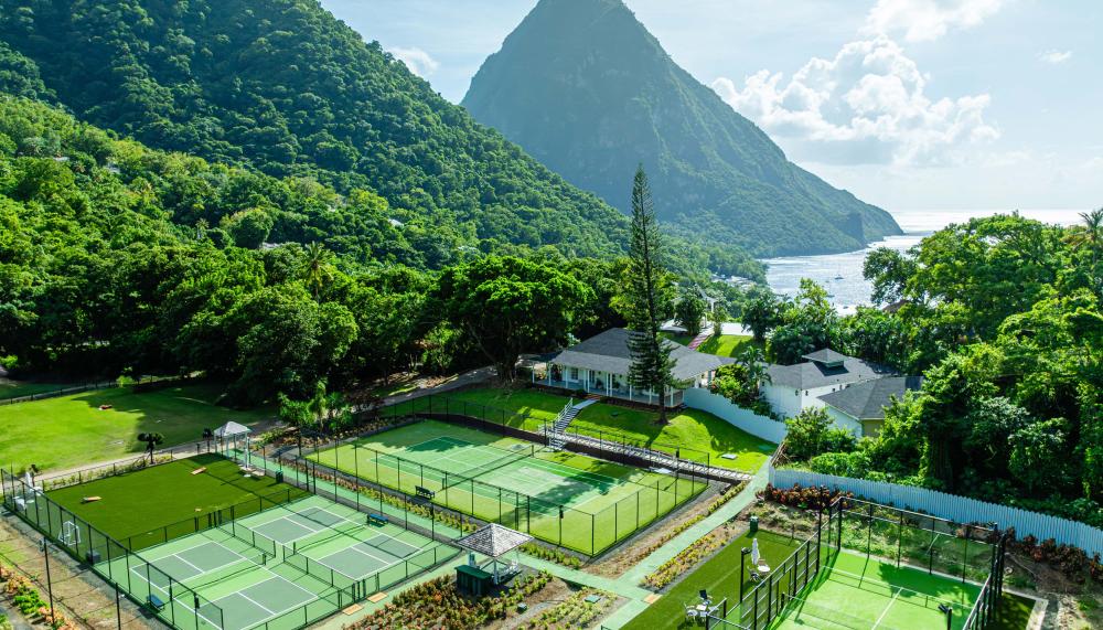 Three racquet courts and a view of the beautiful mountains at Viceroy Sugar Beach