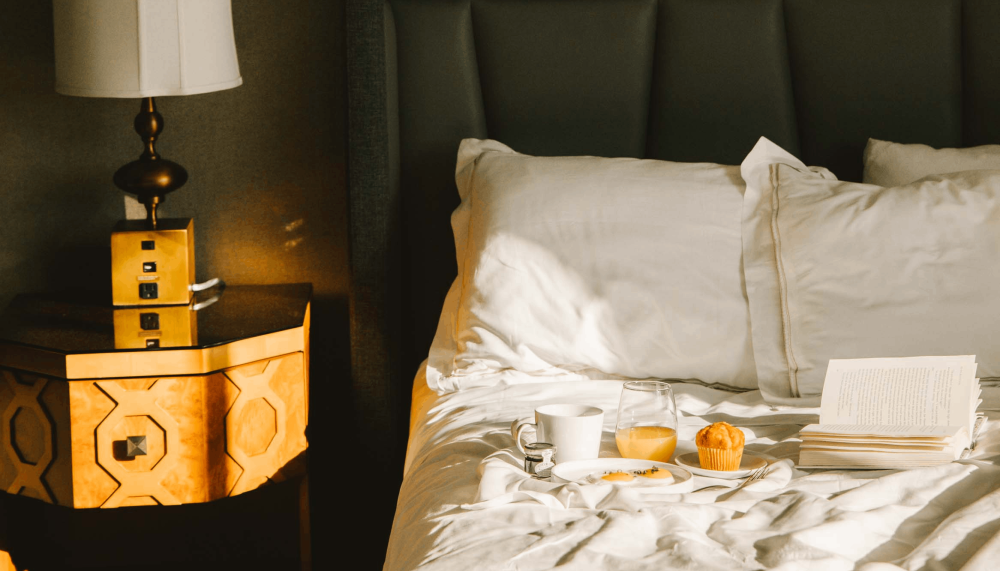 Breakfast on a bed in a room at Viceroy Washington DC