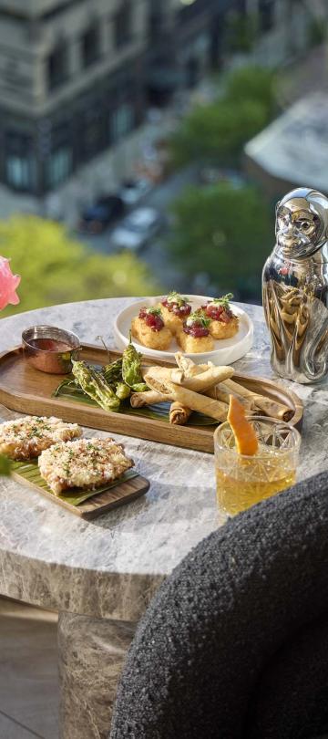 Drinks and snacks on an outdoor dining table