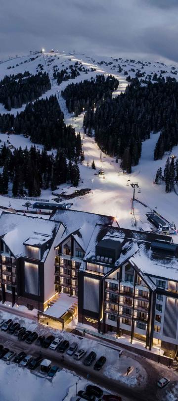 An aerial view of Viceroy Kopaonik Serbia, with the ski slope behind it