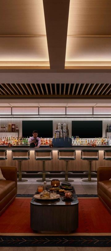 A bartender prepares a cocktail at Viceroy Lounge at Viceroy Snowmass.