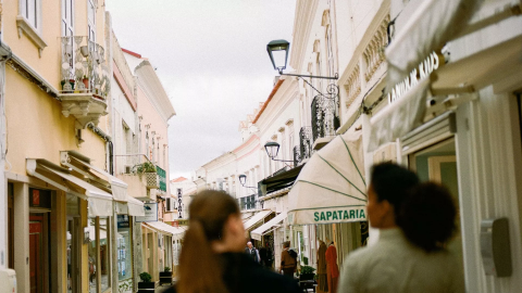 People walking down a street near Viceroy Ombria Algarve