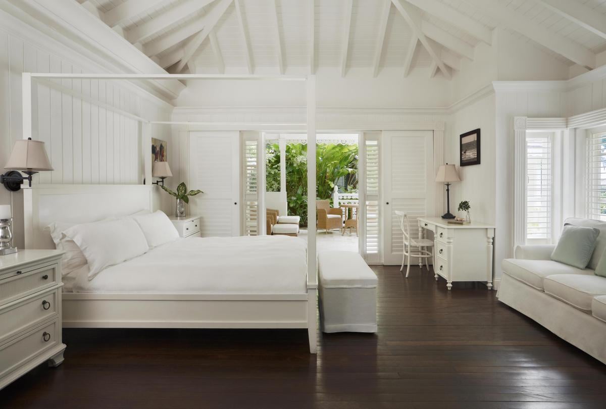 Bedroom with large bed and sofa