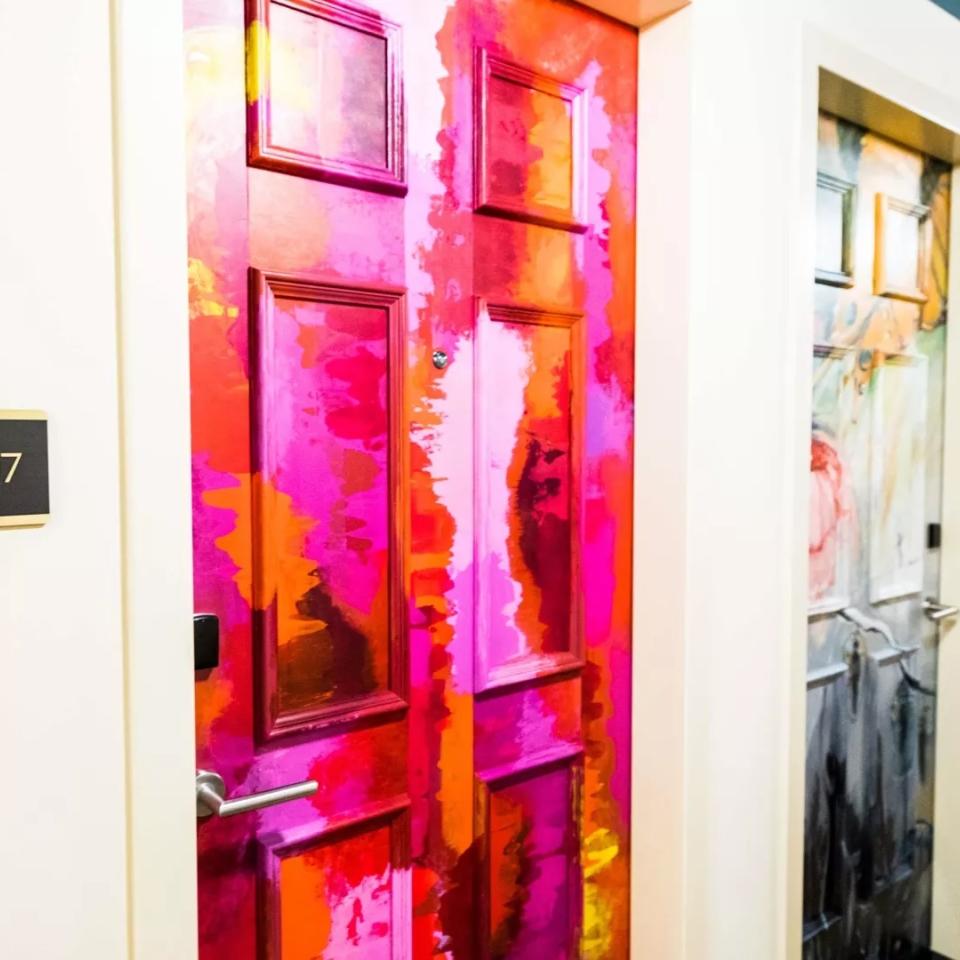 Colorfully painted hotel room doors at a Viceroy Hotel