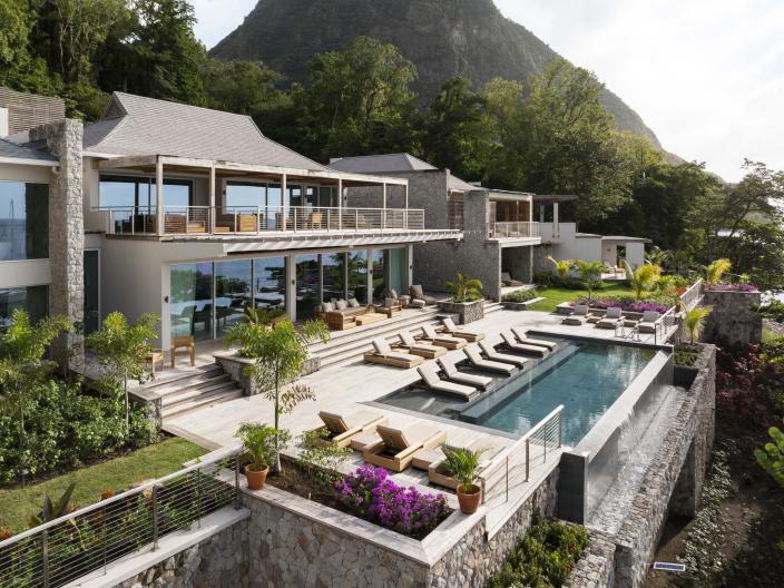 The exterior of Spice of Life Villa, with a private pool and a view of Sugar Beach and the Pitons