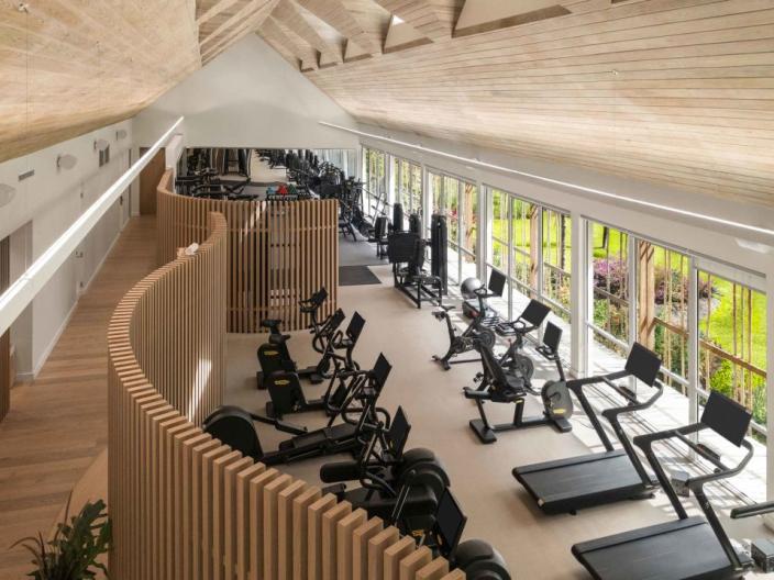 The fitness centre at Viceroy Sugar Beach, with a row of treadmills and exercise bikes