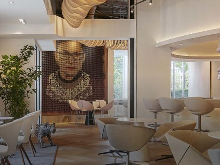 Hotel Zena lobby, featuring a large portrait of Ruth Bader Ginsburg