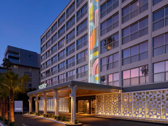 The exterior facade of Viceroy Santa Monica, with a large mural of kaleidoscopic colors