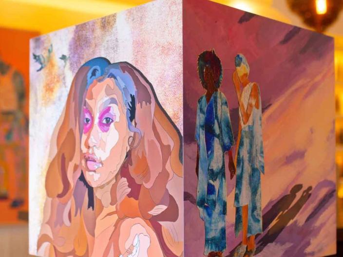Art at Viceroy Washington DC featuring a portrait of a woman painted on a cube