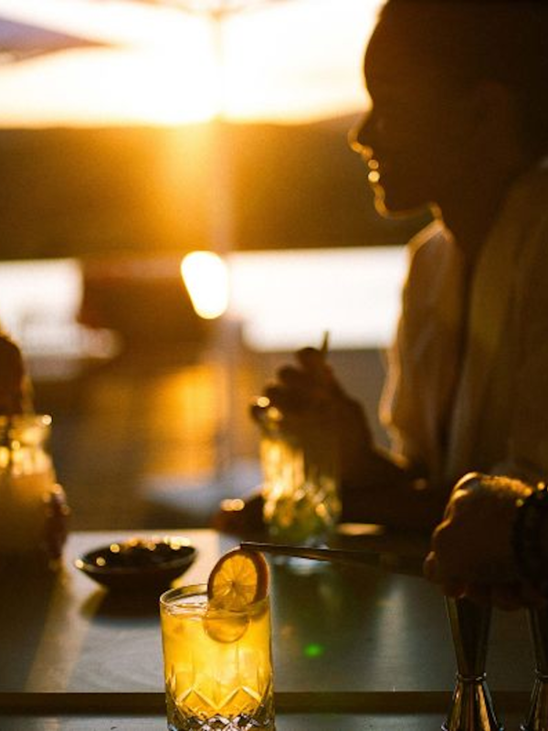 Three people poolside at Salpico pool bar at Ombria ALgarve