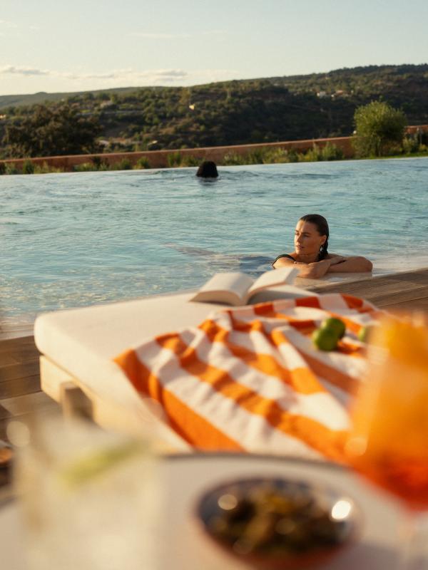 A few people hanging in the pool at Ombria Algarve