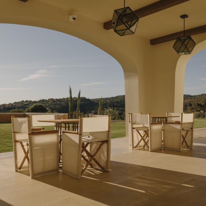 A sunny arched courtyard at Viceroy Ombria Algarve with view of the Algarve countryside